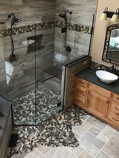 a bathroom with a walk in shower sitting next to a sink and a bathtub