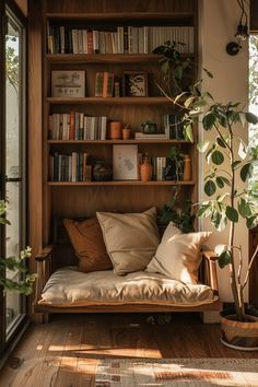 a living room filled with lots of furniture and bookshelves next to a window