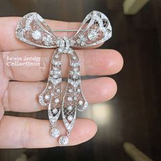 Thank you for coming in! Beautiful rare Belle Epoque era antique diamond platinum brooch! The design and craftsmanship are exquisite and delicate! The arms have movable joints. Weight: 20.67 grams Size: 2.6 inch x 2.1 inch Precious Metal: Platinum Precious stones: -Diamond: 4.2 carats total White Gold Brooches With Single Cut Diamonds In Platinum, Platinum Brooches With Single Cut Diamonds In White Gold, Classic Platinum Brooch With Brilliant Cut, Classic White Gold Brooch With Brilliant Cut, Fine Jewelry White Gold Brooches With Brilliant Cut, Fine Jewelry White Gold Brooch With Brilliant Cut, Fine Jewelry Diamond Brooches With Single Cut Diamonds, Platinum White Gold Fine Jewelry Brooch, Vintage Platinum Brooches With Diamond Accents