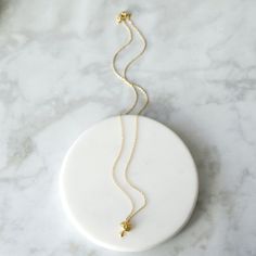 "Beautiful and lovely tiny Mushroom necklace in gold color. Made of matte-finished dainty Mushroom charm with gold plated skinny brass chain. Soft and warm. Great for gift, everyday or special occasion. Your item will ship in a gift box. Please feel free to contact me if you have any questions. ♥ Length 14\" - 18\" ♥ Mushroom charm 3/8\" x 1/2\" ♥ Gold plated over brass ♥ See more Rudiana Accessories Rudiana.etsy.com" Tiny Gold-plated Charm Necklaces, Tiny Gold Plated Charm Necklaces, Delicate Gold Charm Necklaces In Brass, Tiny Minimalist Gold Plated Charm Necklaces, Minimalist Tiny Charm Necklaces In Gold Plated, Minimalist Tiny Gold Plated Charm Necklaces, Tiny Minimalist Gold-plated Charm Necklace, Tiny Gold Minimalist Charm Necklaces, Gold Delicate Minimalist Charm Necklaces