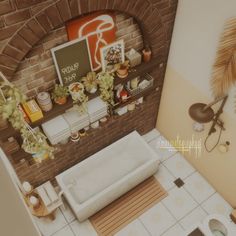 an aerial view of a bathroom with brick walls and flooring, including a bathtub