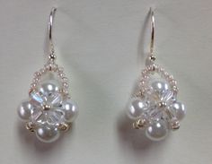 a pair of white pearl and crystal earrings