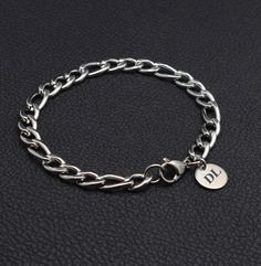 Personalized gifts such as a link chain bracelet are a thoughtful gift for him. Crafted from high-quality silver stainless steel, this chain bracelet features a sophisticated design that is both stylish and durable. Perfect for everyday wear or special occasions, this bracelet makes a great gift for yourself or a loved one. Add a touch streetwear style to your outfit with this sleek and modern accessory. 👉 Custom engraving on bracelets with a special message, whether it's initials, initials with symbol (♥ or & or + or  name, a significant date or short inspiration phrase.  ☝️ Customize engraved makes this mens link chain bracelet a truly unique and personal gift for any occasion (birthday, anniversary, dating day, Valentine's Day, Christmas). Product details: ✅ Bracelet material - silver Initial Bracelet Men, Bracelets Minimalist, Jewelry For Him, Figaro Bracelet, Bracelet Man, Boys Bracelets, Mens Chain, Thoughtful Gifts For Him, Mens Bracelet Silver