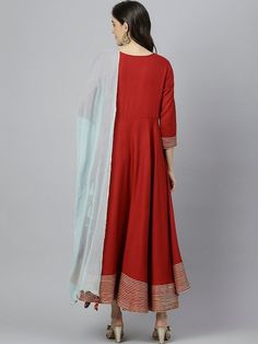 Size & Fit Sizes: To Fit Bust (in inches): S(34), M(36), L(38), XL(40), 2XL(42), 3XL(44) Length: 50 inches PRODUCT DETAILS Consists of a kurta and dupatta Kurta Color: maroon Dupatta color: Blue Solid Round neck Three-quarter, regular sleeves Anarkali shape with angrakha style Ankle length with flared hem Material & Care Viscose Rayon Hand-wash Complete The Look You'll love the elegant design and fit of this stunning dress from Vitans. Dress up for your next family event by pairing this piece wi Full-length Churidar For Navratri, Eid Full Length Dupatta, Full Length Dupatta For Eid, Full-length Zari Work Dupatta, Fitted Anarkali Style Handloom Dupatta, Fitted Anarkali Handloom Dupatta, Fitted Handloom Anarkali Dupatta, Festive Red Ankle-length Kurta, Fitted Anarkali Handloom Kurta