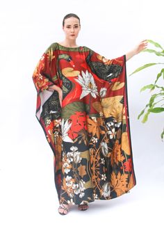 A full length kaftan plus size featured with the vintage inspirations feature the tree of life print  will bring the elegant vibe of Oriental' spring and would be a perfection for holiday occasions or any eventn you attend. The fabric is blended silk with more than 80% silk so the care is more easier with washing and iron, in addition less wrinkles. It's totally smoothly flowy, soft and gentle touch. FEATURES - Black, Red, Yellow - Tree of Life, Vintage Vibe - Personal Custom Made - Full Length Red Oversized Bohemian Kaftan, Red Vintage Maxi Dress For Vacation, Vintage Red Maxi Dress For Vacation, Vintage Long Kaftan For Beach, Vintage Multicolor Long Kaftan, Red Flowy Kaftan With Kimono Sleeves, Flowy Red Printed Kaftan, Vintage Red Maxi Dress For Beach, Red Floral Print Tunic Kaftan