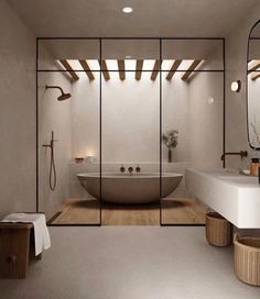 a bathroom with a large tub, sink and mirror in it's center area