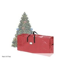 a christmas tree with a red bag in front of it