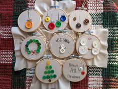 a bunch of different types of embroidery on a piece of white fabric with buttons and thread