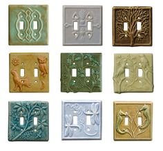 nine decorative light switch plates in different colors