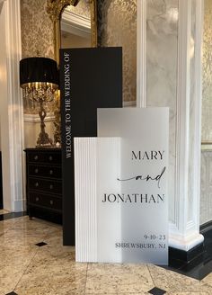 a sign that says mary and jonathan on it in the middle of a marble floor