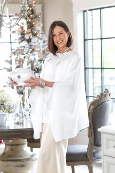 This gorgeous new addition to our Calabria Collection is perfect for a night on the town or dressed down with jeans running errands. Either way you’ll look elegant with classic style. This flowy top is crafted from lightweight viscose fabric for a look that's distinguished yet comfortable. This poncho comes in one size and is 100% viscose. Flowy Top, Calabria, Flowy Tops, Viscose Fabric, Linen Clothes, Dressed Down, Nightwear, Running Errands, Classic Style