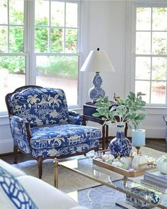 a living room with blue and white furniture