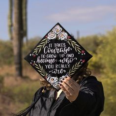 a woman wearing a graduation cap that says it takes courage to grow up and become who you really are