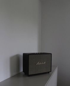 a radio sitting on top of a white shelf