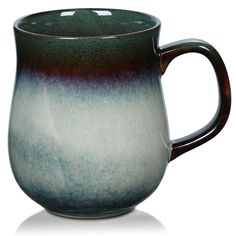 a blue and white coffee mug on a white background with reflection in the cup's bottom