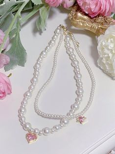 This price is for a necklace only, others are not included. Double Strand Pearl Necklace With Beads, Pearl Pendant Necklace With Heart Beads, Beaded Rhinestone Necklace Costume Jewelry Gift, White Beaded Rhinestone Pearl Necklace, Pearl Beaded Rhinestone Necklace Gift, Beaded Pearl Rhinestone Necklace For Gift, Pearl Necklaces With Heart Beads, Pearl Necklaces With Heart Shaped Beads, Pearl Beaded Necklace For Costume Jewelry