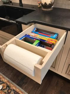 a roll of toilet paper is sitting in the drawer