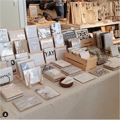 a table topped with lots of different types of cards and boxes on top of it