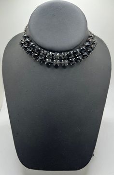 One of a kind Swarovski crystal choker, very glamorous upscale goth look. The choker is wide and has antique  silver chain and prong settings with extender and heart charm. The crystals are 8mm spikes in  jet black onyx shade.  Matching earrings and bracelet available. I have shown another choker in the photos   but this listing is for the black 8mm spike crystal choker. Edgy Metal Evening Jewelry, Black Metal Rhinestone Necklace For Party, Black Rhinestone Choker Jewelry, Party Black Rhinestone Metal Necklace, Costume Jewelry Choker For Party, Gothic Choker For Formal Occasions, Adjustable Jeweled Choker For Parties, Formal Gothic Metal Choker, Evening Rhinestone Metal Choker Necklace