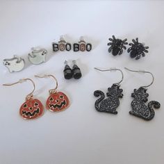 Set Of Six Hypoallergenic Halloween Themed Earrings. Great Addition To Your Costume Jewelry Collection. Set Includes: Orange And Black Enamel Jack-'O-Lantern Pumpkin Dangle Earrings Black With Silver Sparkles Cat Silhouette Dangle Earrings White Sparkly Ghost Post Earrings Black And Orange Sparkly "Boo" Post Earrings Sold Black Round Geometrical Post Earrings Solid Black Enamel Spider Post Earrings All Earrings Have Clear Silicone Earring Backs For A Secure And Comfortable Fit. Earrings Are New Fun Black Halloween Jewelry, Fun Black Jewelry For Halloween, Trendy Black Halloween Earrings, Themed Black Earrings For Party, Themed Black Party Earrings, Fun Black Hypoallergenic Earrings, Black Hypoallergenic Fun Earrings, Novelty Black Halloween Earrings, Black Hypoallergenic Halloween Earrings