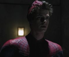 the amazing spider - man is wearing a pink bow in this scene from the movie