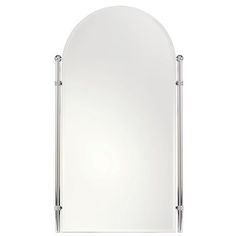 a large white mirror sitting on top of a wall