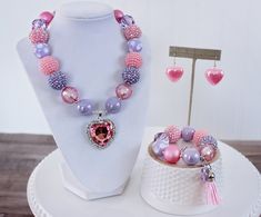 "~BE MINE~ features a beautiful heart-shaped rhinestone pendant and a pink and lavender Valentine's Day inspired palette. Will look great in photos and as an extra added touch for Valentine's outfits. Visit my Valentine's Day section for more necklaces: https://www.etsy.com/shop/ChunkyStuffByLBB?ref=l2-shop-info-name&section_id=16078747 ✔ Necklaces come in child to adult sizes with a 2\" extender chain and jumbo lobster clasp for easy fastening. Since these necklaces are adjustable my one ch Valentine Necklace, Be Mine Valentine, Halloween Bracelet, Purple Beads, Valentines Outfits, Valentines Necklace, Pink Beads, Be Mine, Chunky Necklace