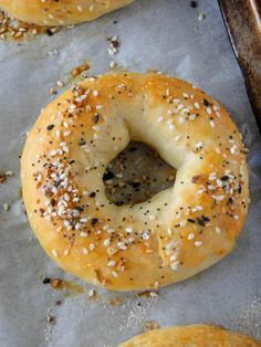 bagels with sesame seeds and poppy seeds are on the baking sheet, ready to be baked