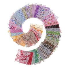 an assortment of different colored fabrics arranged in a circular pattern on top of each other