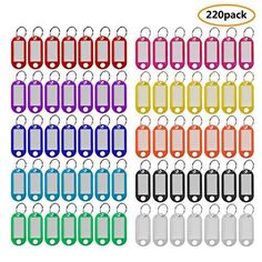 many different colored dog tags with numbers on them