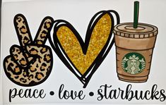 the peace love starbucks sign is next to a coffee cup with a leopard print on it