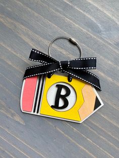 This is the perfect addition to your teacher bag. It can also be used as: -Car Charm -Christmas stocking personalized tag -Great as a ornament for your Christmas tree Details: -It's a 3D wood baseball or softball tag with ribbon and a carabiner for easy attachment. -Approximately 4 inches -Personalize it with your kids name -Laser cut 1/4 wood, painted and sealed with a protective clear coating that prevents chipping, peeling or fading. -Ribbon can be different than the one pictured. *RETURNS/EX Personalized Cute Craft Supplies For Teacher Appreciation, Educational Back To School Craft Supplies Gift, Customizable Educational Craft Supplies For Gifts, Teacher Bag, Bogg Bag, Teacher Bags, Bag Tag, Car Charms, Teacher Life