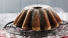 a bundt cake sitting on top of a metal rack