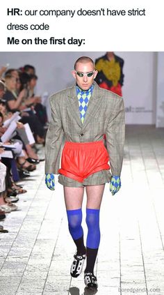 a man with short shorts and colorful socks on the catwalk at moda meska lato