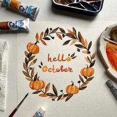 an art project with watercolors and paint on paper that says hello october surrounded by pumpkins