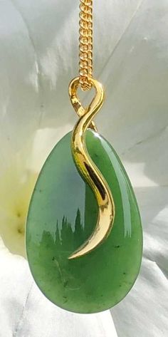 Beautiful teardrop shape jade pendant in gold-tone setting. The genuine Canadian nephrite jade stone measures 27mm long. Add it to your favorite gold chain for a stunning look! A Grade Canadian Nephrite Jade All of our Jade is 100% natural. 30 day satisfaction guarantee! Jade is a natural stone, so the shade of color may vary slightly. All of our jade is grade A, unless otherwise noted. It is 100% Pure Nephrite Jade, with no treatments whatsoever. What is Jade? Jade is one of two gemstones, nephrite jade or jadeite jade. Nephrite jade , (a silicate of calcium and magnesium), is the historical Chinese Jade, or Stone of Heaven, a stone revered by the Chinese for more than 5000 years. Nephrite is prized for its special qualities: its extreme toughness, (the toughest of any natural stone), its Gold Teardrop Jade Jewelry, Chinese Jade, Nephrite Jade, Teardrop Pendant, Jade Jewelry, Magnetic Bracelet, Natural Jade, Jade Stone, Jade Pendant