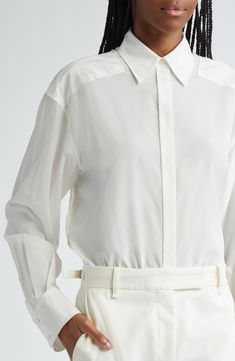 Partial yokes emphasize the dropped shoulders of this silk-enriched button-up shirt that was a featured look on the label's fall '24 runway. 29" length (size 2) Hidden-button placket Point collar Long sleeves with button cuffs 50% viscose, 42% silk, 8% elastane Dry clean Imported Designer Clothing Spring Silk Blouse For Business, Silk Business Blouse For Spring, Luxury Spring Shirt With Button Closure, Classic Silk Shirt For Spring, Luxury Buttoned Shirt For Spring, Luxury Fall Tops For Daywear, Luxury Spring Daywear Blouse, Luxury Spring Blouse For Daywear, Luxury Fall Daywear Tops