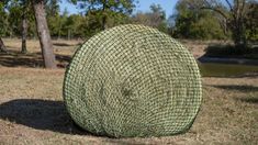 a large round object sitting in the middle of a field