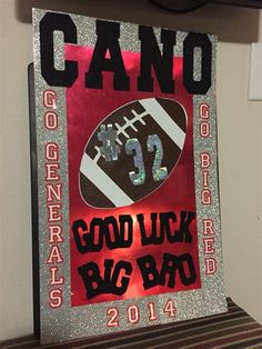 a sign that reads, good luck big bad 2013 and has a football on it