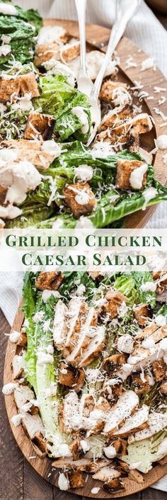 grilled chicken caesar salad on a wooden platter