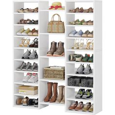 a white shelf filled with lots of shoes and bags