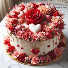 a heart shaped cake with roses and hearts on it's top, sitting on a table