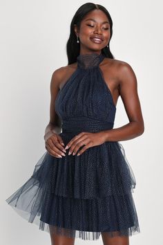 With your favorite heels and sparkling jewelry, you'll be ready to enchant everyone you meet in the Lulus Sweet Magic Navy Blue Glitter Tiered Tulle Halter Mini Dress! Fluffy sheer tulle, adorned with sparkling silver glitter throughout, shapes this adorable dress with a high, tying halter neckline that supports a gathered bodice. Banded, gathered waist sits atop a tiered skirt that ends at a flirty mini hem. Hidden back zipper/clasp. Fit: This garment fits true to size. Length: Mid-thigh. Size Glitter Tulle Party Dress, Evening Dresses In Glitter Tulle, Evening Dresses With Glitter Tulle, Evening Dress With Glitter Tulle, Party Glitter Tulle Dresses, Holiday Prom Dresses In Glitter Tulle, Summer Party Dress In Glitter Tulle, Elegant Holiday Dresses In Glitter Tulle, Blue Glitter Mini Dress For Evening