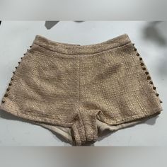 Gold Tweed W Studs. Ones Small And They Are Pretty Short Chic Tweed Shorts, Fitted Tweed Shorts, Chic Summer Tweed Shorts, Chic Summer Tweed Bottoms, Chic Tweed Shorts For Summer, Beige Party Bottoms Short Length, Short Tweed Bottoms For Spring, Spring Short Tweed Bottoms, Short Tweed Bottoms For Summer