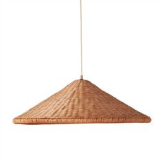 a bamboo light fixture hanging from a ceiling