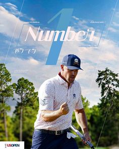 a man holding a golf club on top of a cover with the number 1 in it