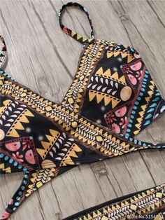 The Aztec Temptation Hollow Out Strappy Bandage Bikini is the perfect combination of fashion and style. This beautiful bikini is designed with a strappy bandage and a unique Aztec pattern. Its lightweight fabric and secure fit offer unparalleled comfort, making it an ideal choice for a fun day in the sun. modname=products&cols=5&colspace=10&rowspace=10&showName=true&showPrice=true 2018 Sexy Bandage Aztec Biquini String Strappy Swim Wear Bathing Suit Swimsuit Beachwear Swimwear Women Brazilian Bi Summer Swimwear With Wrap-around Straps For Vacation, Beachwear Swimwear With Wrap-around Straps, Beachwear Swimwear With Adjustable Spaghetti Straps, Vacation Swimwear With Crisscross Straps And Triangle Top, Beach Swimwear With Crisscross Straps Triangle Top, Triangle Top Swimwear With Crisscross Straps For Beach, Black Cross-tied Beachwear Swimwear, Black Adjustable Strap Swimwear, Adjustable Spaghetti Strap Swimwear For Beach