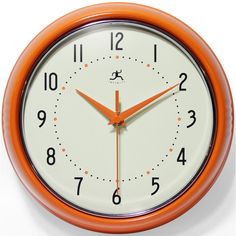 an orange and white wall clock with numbers on the face, set against a white background