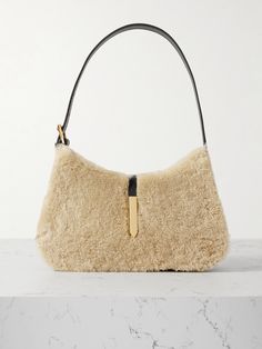 Drawing inspiration from the "dynamism of city life", DeMellier's sleek 'Tokyo' bag has been handcrafted in Spain from smooth leather and fluffy shearling and is decorated with hints of glimmering gold-tone hardware. It's perfectly sized to fit daily essentials such as your phone, keys and wallet. <br><br> Lower-Impact Materials. This product is made using at least 50% lower-impact materials or ingredients. <br><br> Designed for Circularity. This Shoe Branding, Raffia Bag, Belt Bags, Bag Collection, Reduce Waste, Ranch Style, Daily Essentials, Summer Hats, Beauty Accessories