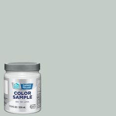 a jar of blue paint with the words color sample on it's front and side